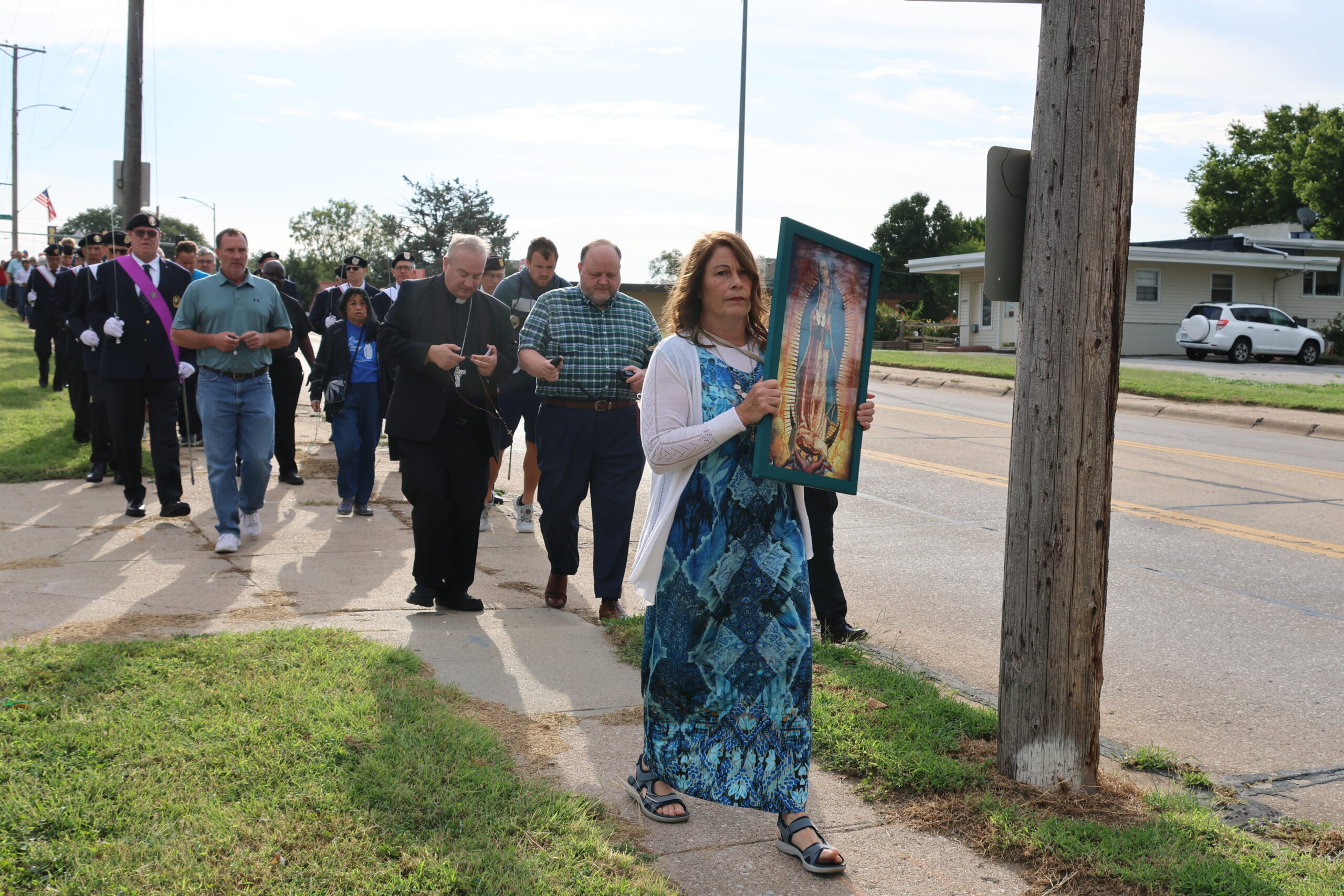 An image of Our Lady of Guadalupe, patroness of the unborn, leads a rosary procession at the Sept. 12 Archbishop's Vigil for Life in Bellevue. Judy Mansisidor holds the image, followed by Archbishop McGovern and other participants, who prayed as they walked from St. Mary Church in Bellevue to a nearby abortion clinic. SUSAN SZALEWSKI